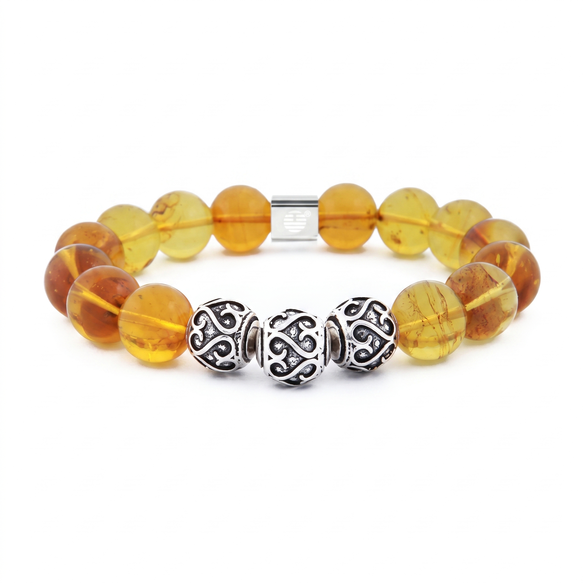 A beaded stretch bracelet featuring translucent amber-yellow glass beads with natural inclusions, accented by three ornate silver spacer beads and a silver magnetic clasp, shown on a plain white background.