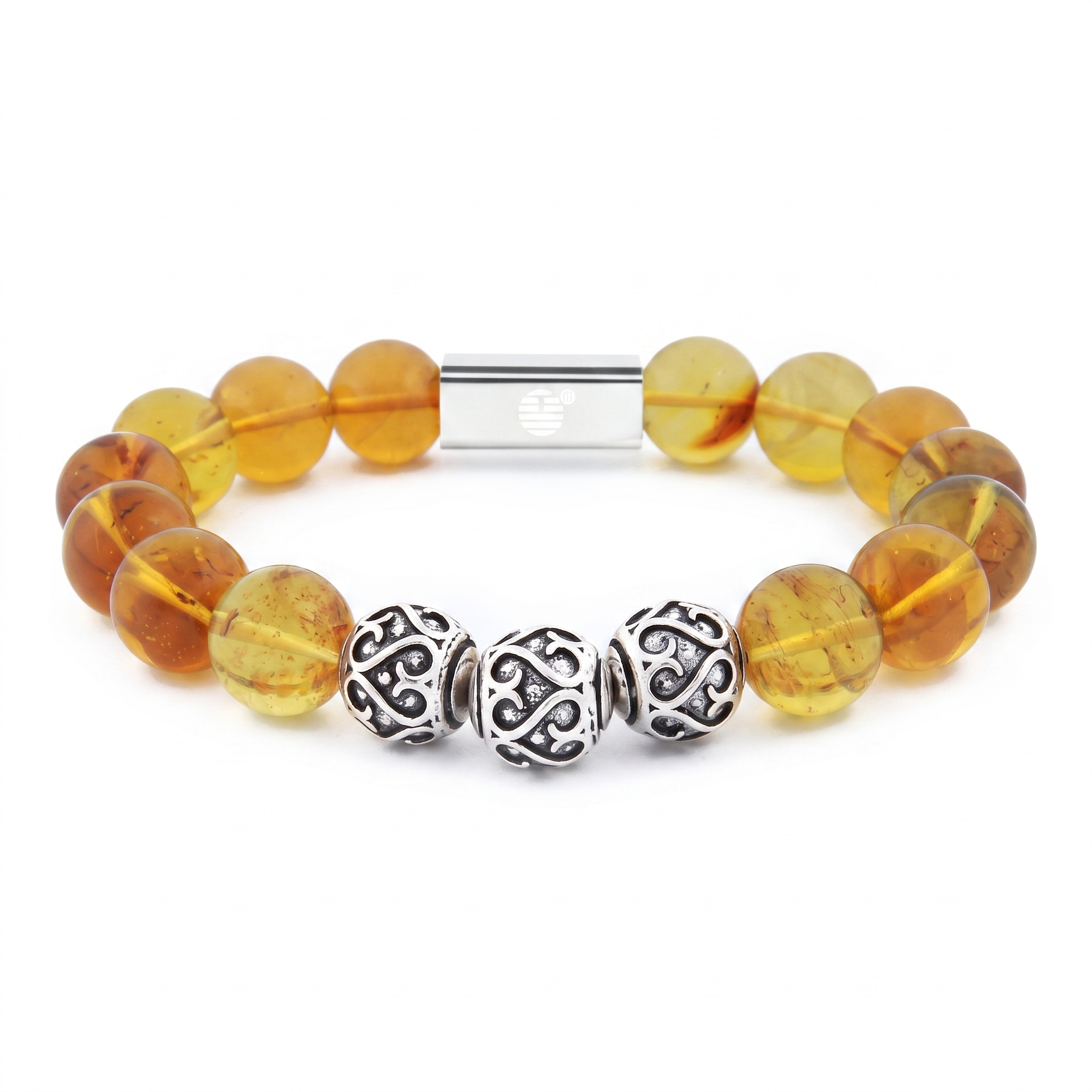 A beaded stretch bracelet featuring translucent amber-yellow glass beads, three ornate silver filigree spacer beads, and a silver magnetic clasp, shown on a plain white background.