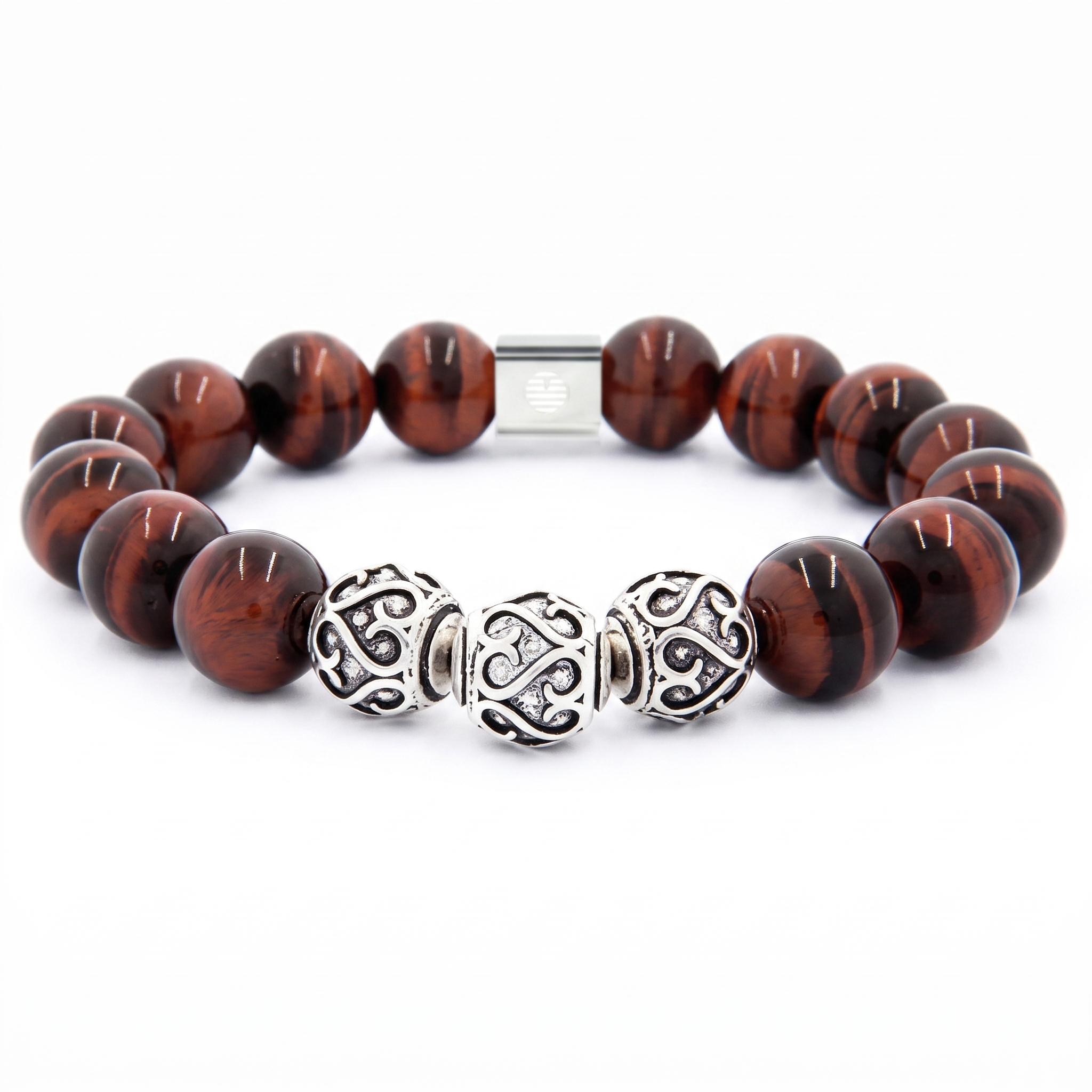 A beaded stretch bracelet featuring round brown tiger's eye beads, three ornate silver filigree spacer beads, and a silver magnetic clasp, shown on a plain white background.
