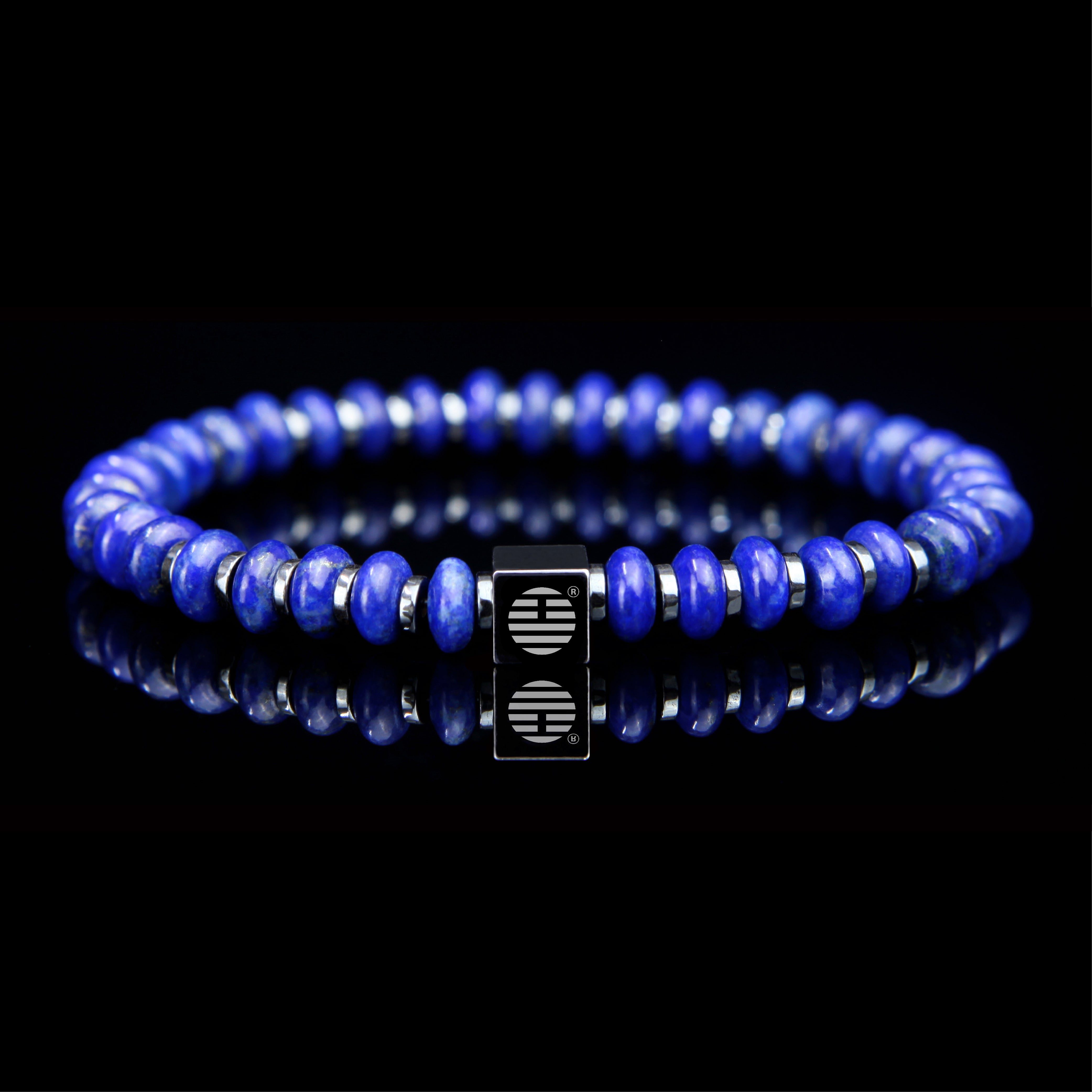 Blue Lapis Lazuli Flat-Faced beaded bracelet with a silver clasp on a black background