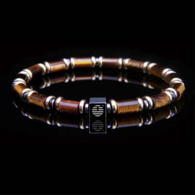 Bracelet with wooden beads and metal clasp on a black background