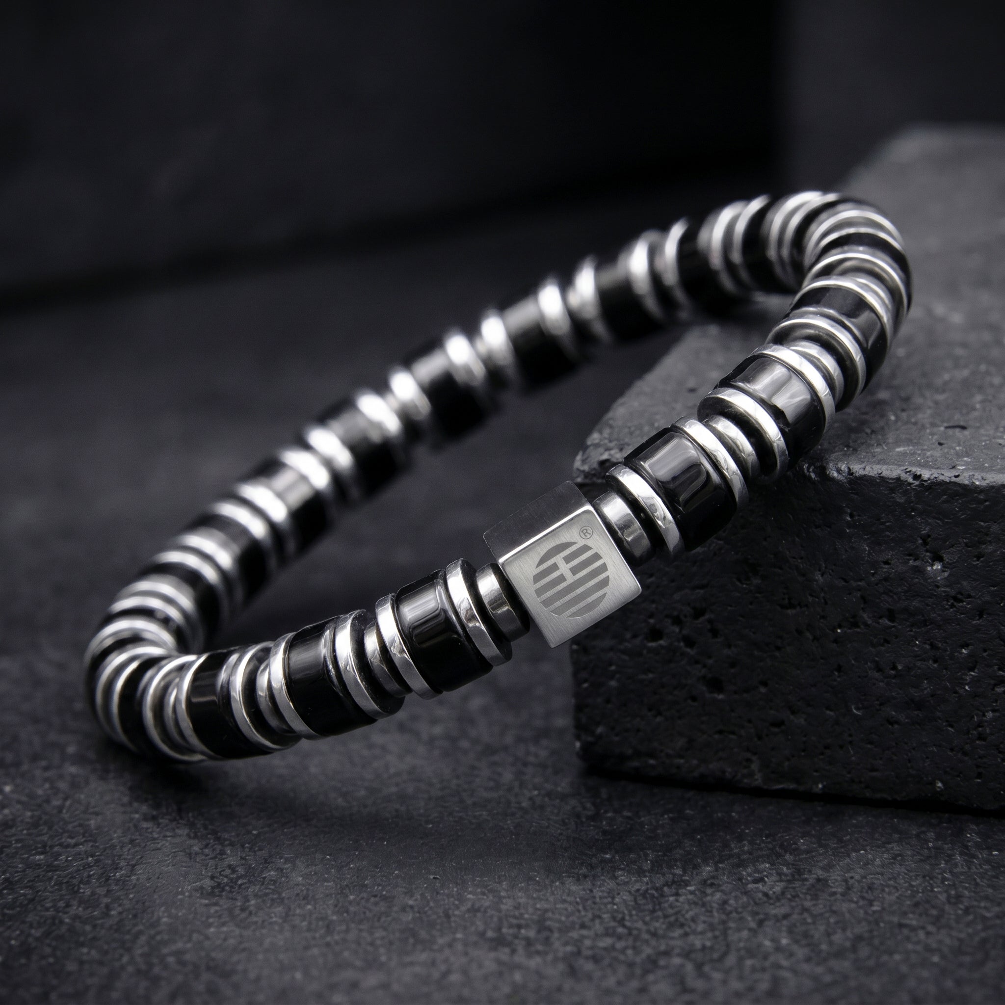 My Enchanter Black Obsidian with Silver washer beaded bracelet on a dark surface