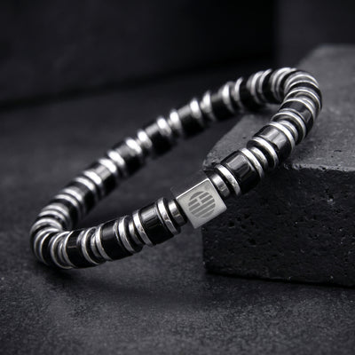 My Enchanter Black Obsidian with Silver washer beaded bracelet on a dark surface